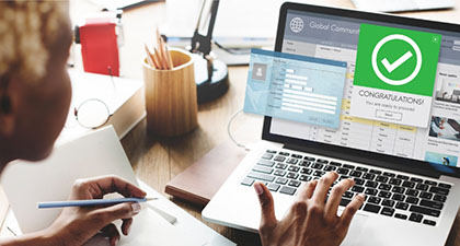 Person enrolling in a dental discount plan on a laptop.