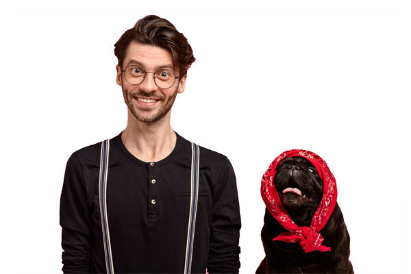 Man smiling with a dog.